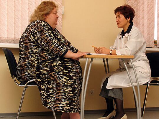 Patient with varicose veins due to obesity at a phlebologist's consultation